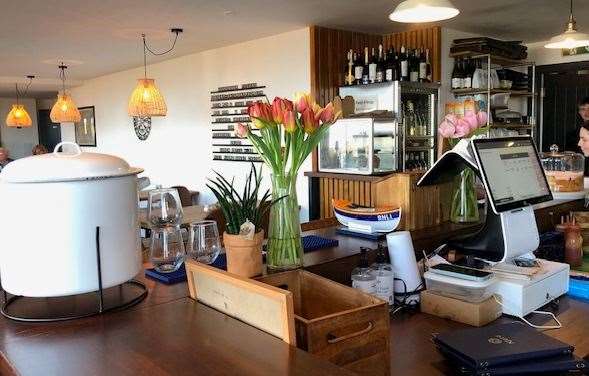 The bar featured a pair of vases with freshly cut tulips as well as a good-sized water dispenser