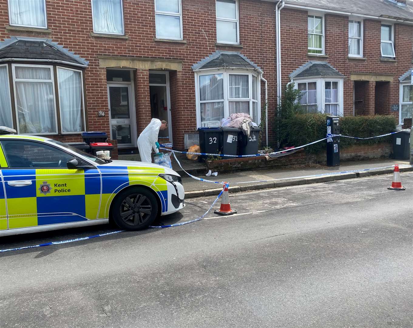 Police forensics teams carrying out investigations in St Martin's Road, Canterbury, in July last year
